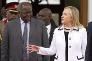 1. US Secretary of State Hillary Clinton meets with Kenyan President Mwai Kibaki at the State House in Nairobi. Clinton has urged Kenyans to work together to ensure "transparent" elections next year and avoid a repeat of the deadly post-poll violence four years ago. Clinton has urged Kenyans to ensure "transparent" elections next year and avoid a repeat of the post-poll violence four years ago. (AFP Photo/Jacquelyn Martin)