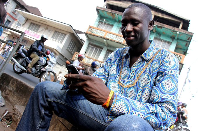 Harry Kargbo helped monitor Sierra Leone's recent presidential election using his cell phone [Travis Lupick/Al Jazeera]