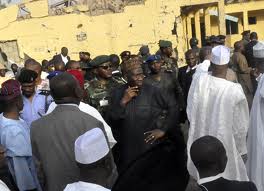 President Jonathan stands with gov't officials during his visit to the police HQ in the Northern city of Kano in Jan 2012,following a bomb attack..Photo Reuters/Stringer