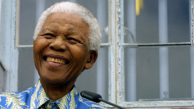 Former South African President Nelson Mandela has struggled against apartheid most of his life. Here he speaks in front of his former prison cell on Robben Island in 2003. Mandela was imprisoned in 1963 and released on February 11, 1990.