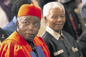 HISTORY OF AFRICAN HUMANISM: Nigerian author Professor Chinua Achebe receives an honorary doctorate from the University of Cape Town. Next to him is former president Nelson Mandela. Both leaders have given the gift of ubuntu to the world