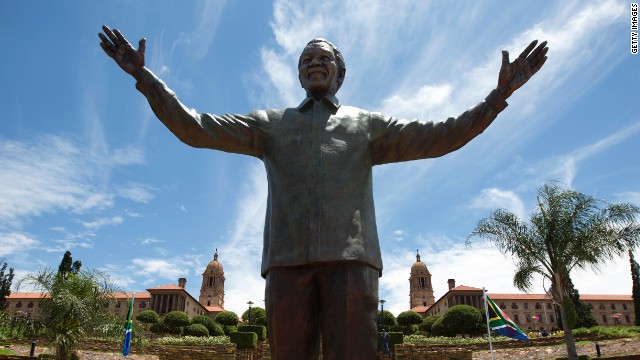 A statue of former South African president Nelson Mandela is unveiled at the Union Buildings in Pretoria on December 16, 2013.