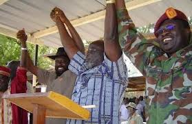 Leaders of SPLM join their hands following successful reconciliation between John Garang and Salva Kiir in Rumbek, Dec. 1, 2004 (ST)Can the current leaders learn from this?