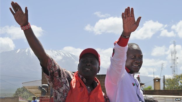 Kenya's President Uhuru Kenyatta (R) won disputed elections in 2013