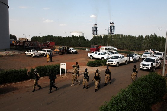 The richest oil fields in South Sudan's Unity and Upper Nile states remain mired in conflict. Shown, soldiers walk past the Paloch oil-field facility in Upper Nile State in March. Reuters
