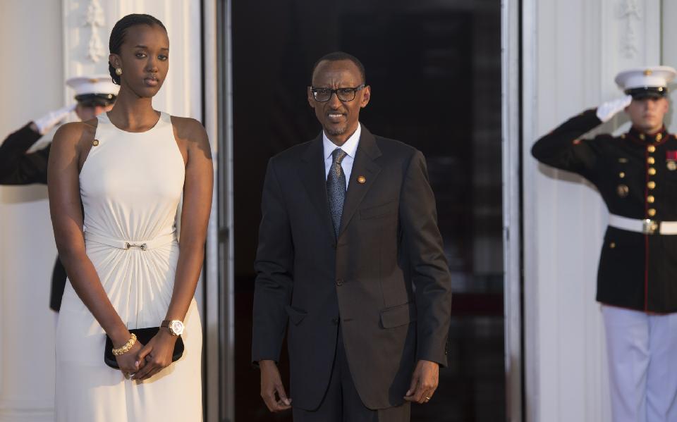 Rwanda President Paul Kagame and daughter arrive at the White House for a group dinner during the US Africa Leaders Summit August 5, 2014 in Washington, DC (AFP Photo/Brendan Smialowski)