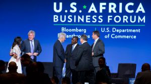 Bill Clinton shakes hands with US and African business leaders at the African Business Forum in Washington, DC. Doug McMillon, CEO of Walmart, is on the far right. Jacquelyn Martin/AP
