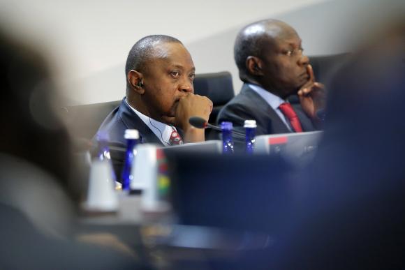 Kenya's President Uhuru Kenyatta listens to opening remarks at the start of the U.S.-Africa Leaders Summit Session One on 'Investing in Africa's Future', at the U.S. State Department in Washington August 6, 2014. Also pictured is Guinea-Bissau's President Jose Mario Vaz (R). CREDIT: REUTERS/JONATHAN ERNST L