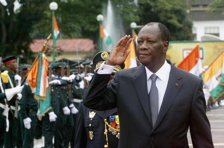 Ivory Coast's President Alassane Ouattara salutes during a parade to commemorate the country's 54th Independence Day, outside the presidential palace in Abidjan August 7, 2014. REUTERS/Luc Gnago.