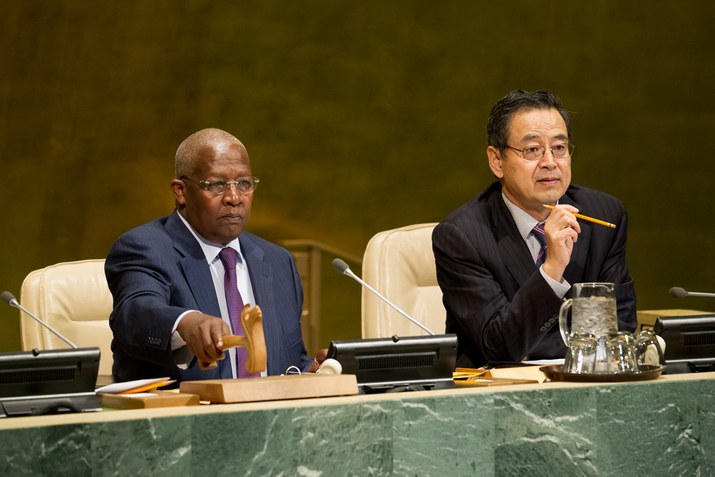 General Assembly President Sam Kutesa (left), and Zhang Saijin, Deputy Director of the General Assembly and Economic and Social Council (ECOSOC) Affairs Division, preside over a meeting on the New Partnership for Africa’s Development (NEPAD). UN Photo/Rick Bajornas