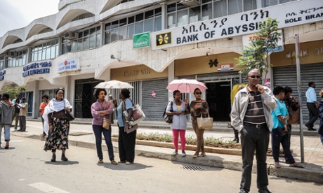 People wait for a bus in Addis Ababa. The government has launched an ambitious modernisation plan in the Ethiopian capital. Photograph: Giorgio Cosulich/Getty