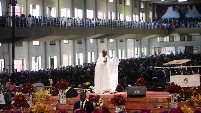 Bishop David Oyedepo (C), founder of the Living Faith Church, also known as the Winners' Chapel, conducts a service for worshippers in the auditorium of the church in Ota district, Ogun state, some 60 km (37 miles) outside Nigeria's commercial capital Lagos September 28, 2014. REUTERS/Akintunde Akinleye