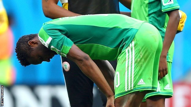 A dejected Mikel Obi Nigeria miss on the continents'biggest soccer tournament