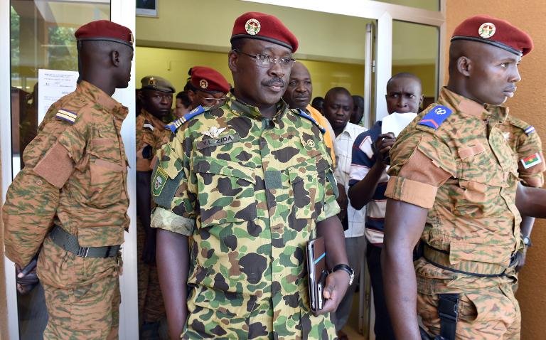 Burkina Faso's Lieutenant-Colonel Yacouba Isaac Zida (C) leaves after a meeting with the country's military commanders on November 1, 2014 in Ouagadougou