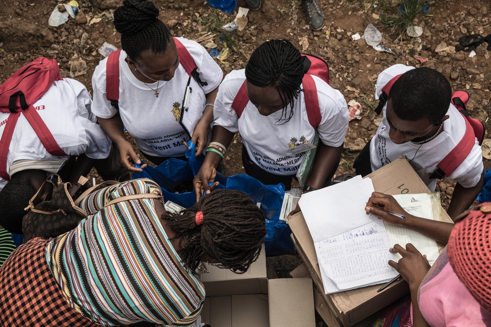 Community health workers help distributing the anti-malaria drugs for 1.5 million people in Freetown.
