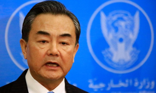 China’s foreign minister, Wang Yi, at a news conference with his Sudanese counterpart Ali Karti in Khartoum on 11 January. Photograph: Mohamed Nureldin Abdallah/Reuters