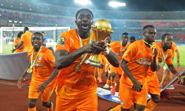Ivory Coast's Kolo Touré raises the trophy after the final. Photograph: Carl De Souza/AFP/Getty Images