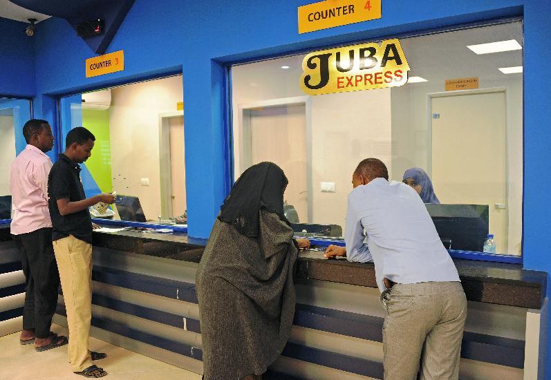 Customers wait for foreign money transfers in Mogadishu on February 12, 2015 in Somalia where no formal banking system exists (AFP Photo/Mohamed Abdiwahab)