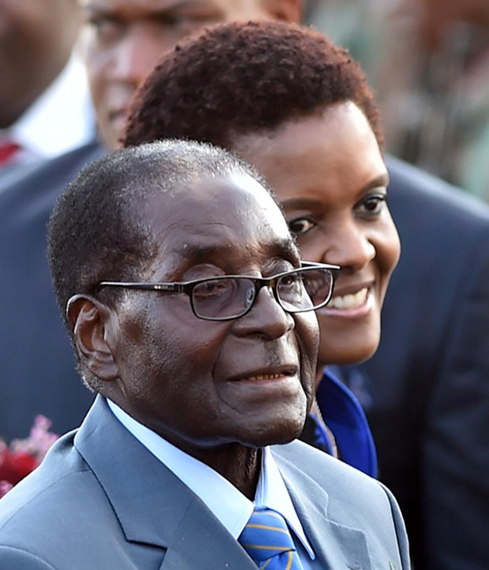 Zimbabwean president, Robert Mugabe, front, and his wife Grace, rear, arrive in Pretoria, South Africa Tuesday, April 7, 2015 for a state visit to the country. Mugabe will be in the country until Thursday and will meet with South African president Jacob Zuma Wednesday.(AP Photo)