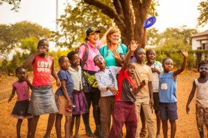 Children from Rose of Charity Orphanage and the surrounding neighborhood together with WorldVentures Foundation Executive Director Gwyneth Lloyd on the right, and Jennifer Ho on the left