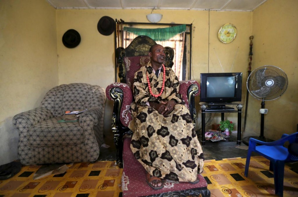 Deputy community chief of Yeneka village Douglas Oguta poses for a portrait in his home on the outskirts of the Bayelsa state capital, Yenagoa, in Nigeria's delta region October 8, 2015. Tensions are building in the swampland of the Niger Delta as an amnesty that aimed to bring stability to Nigeria's volatile southern region is due to expire at the end of the year. While the region's towns and cities are mostly calm, local residents say kidnappings and armed robberies are on the increase in the mangrove swamps, where most oil wells are located. Former military ruler and Muslim northerner President Muhammadu Buhari said in his inauguration speech in May that he might "streamline" the amnesty, implemented in 2009 by his predecessor, Goodluck Jonathan, a Christian like most of the Delta population. The deal aimed to pacify militants fighting for a greater share of oil revenues in Africa's biggest crude producer. At risk are payouts worth $300 million a year to 30,000 youths, money designed to discourage them from blowing up pipelines or kidnapping oil workers in a region where basic services are almost non-existent. REUTERS/Akintunde Akinleye TPX IMAGES OF THE DAYPICTURE 16 OF 24 FOR WIDER IMAGE STORY "TENSIONS IN THE NIGER DELTA". SEARCH "DELTA TENSION" FOR ALL IMAGES.