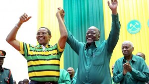 Tanzania's public works minister John Pombe Magufuli, right, celebrates with president Jakaya Kikwete, left, after the ruling party announced its presidential candidate, in Dodoma, Tanzania, Sunday, July 12, 2015. Tanzania's ruling party, which has been in power for five decades, has chosen public works minister John Pombe Magufuli as its presidential candidate, making him the favorite to replace current president Jakaya Kikwete in the upcoming October election. (AP Photo/Khalfan Said) (The Associated Press)