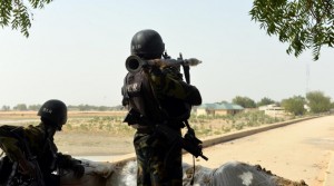 Cameroon troops in position after an earlier attack attributed to Boko Haram (AFP Photo/Reinnier Kaze)
