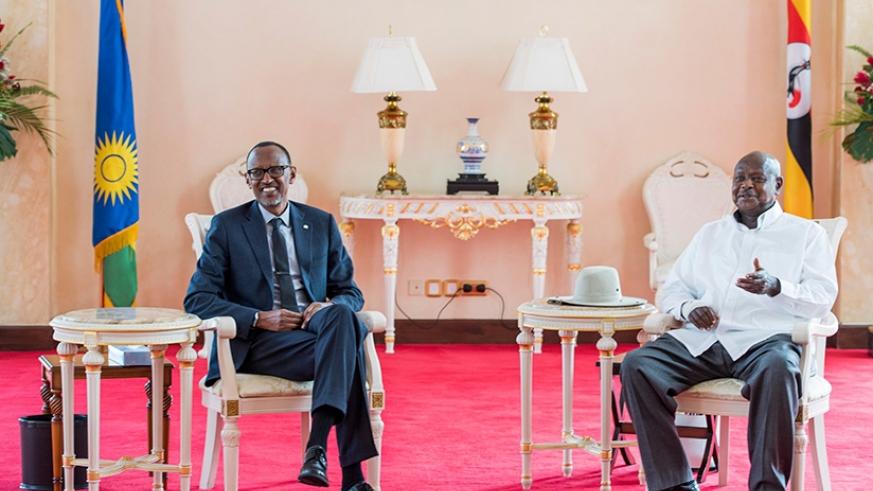 President Kagame (left) chatting with President Museveni