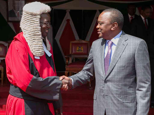 File Picture.President Uhuru Kenyatta congratulates the newly-sworn-in Chief Justice David Maraga at State House. /PSCU