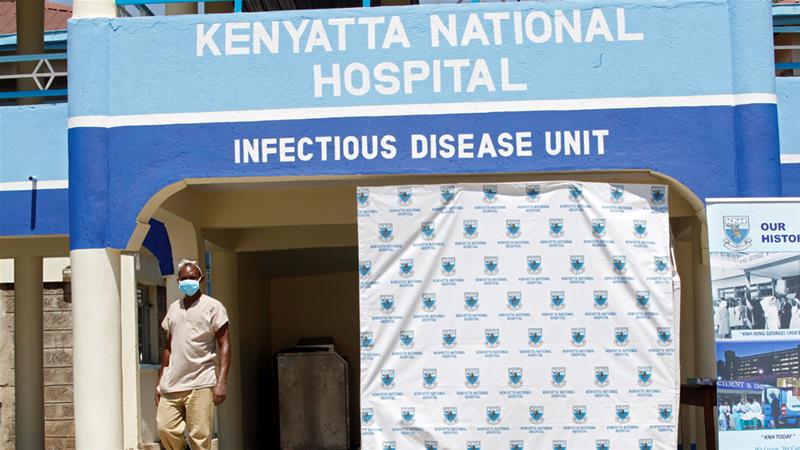 A worker walks outside the coronavirus isolation facility at the Mbagathi Hospital in Nairobi .Photo credit [Njeri Mwangi/Reuters]
