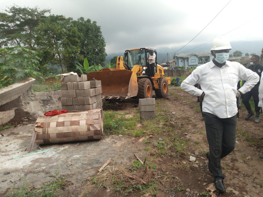 Mayor David Mafani Namange with a face mask during a demolition exercise of illigal building sites in the municipality