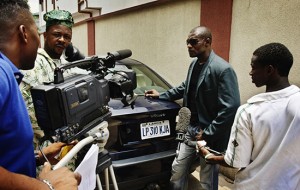 A movie director, actors and a soundman on the set of a low-budget Nollywood movie production. Photo: Panos/Jacob Silberberg