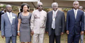 PHOTO | KIBAKI PRESS Former president Mwai Kibaki poses for a group photo with the Great Lakes Student Leaders after presenting him with The Great Lakes Region Student Union Medal during the 90 years of Makerere University Celebrations in Kampala, Uganda.  NATION MEDIA GROUP