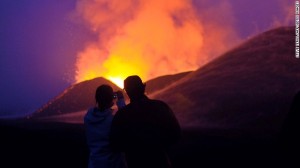 Tampa says Congo has the potential to be a huge tourist attraction, creating jobs and businesses for the region. Tourists take a photo of a volcanic eruption at the Virunga National Park, near Goma.