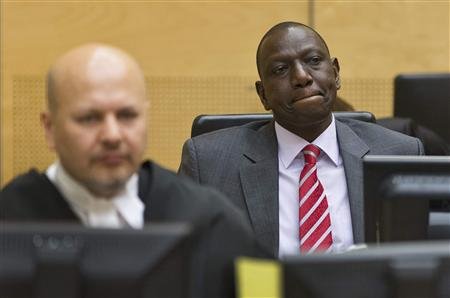 Reuters/Reuters - Kenya's Deputy President William Ruto (R) reacts as he sits in the courtroom before his trial at the International Criminal Court (ICC) in The Hague in this September 10, 2013 file photo. REUTERS/Michael Kooren/Files