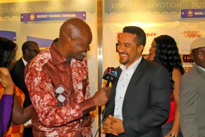 Roger Muntu in doing an interview with Ghanaian Actor Majid Michel at the movie premiere of One Night in Vegas