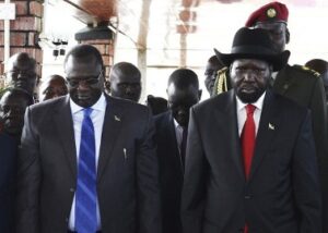 (From L-R) South Sudan’s Vice-President Riek Machar and President Salva Kiir pay their respects at John Garang’s Mausoleum, during the celebration of the 2nd anniversary of South Sudan independence, in Juba, July 9, 2013. (Reuters/Andreea Campeanu)