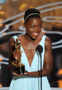 Lupita Nyong’o accepts her Oscar. (Pic: AFP)