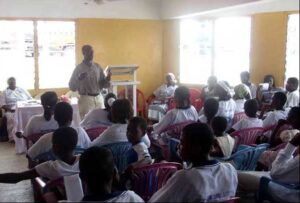 A man gives a talk about the importance of abstinence at a Virgins Club in Ghana to an audience comprising only female members. The Virgins Club is a sub-organisation of the Methodist Church.