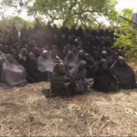 In this photo taken from video by Nigeria's Boko Haram terrorist network, Monday May 12, 2014 shows the alleged missing girls abducted from the northeastern town of Chibok. The new video purports to show dozens of abducted schoolgirls, covered in jihab and praying in Arabic. It is the first public sight of the girls since more than 300 were kidnapped from a northeastern school the night of April 14 exactly four weeks ago. (AP Photo)