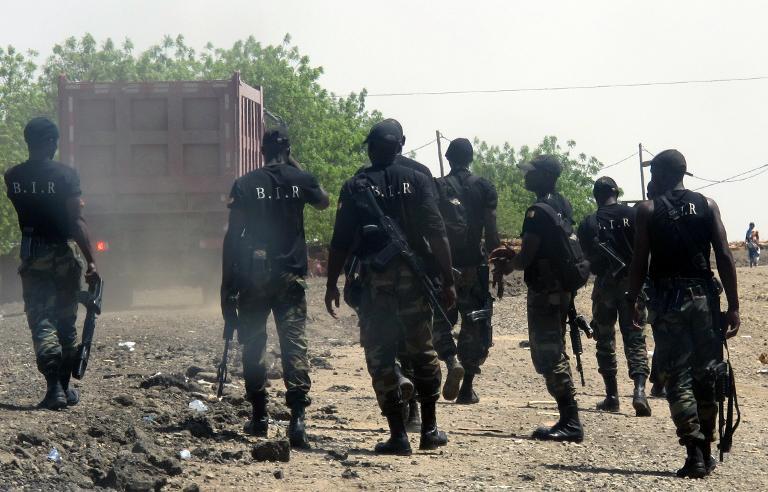 Armed Cameroonian men of the rapid intervention battalion (BIR) patrol in Waza, northern Cameroon on May 29, 2014 (AFP Photo/Reinnier Kaze)