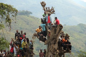 Boys in Kigogo, Democratic Republic of Congo, watched this month as Rwandan militants turned in their weapons. It was the biggest celebration many villagers had known. SARAH FLUCK FOR THE NEW YORK TIMES