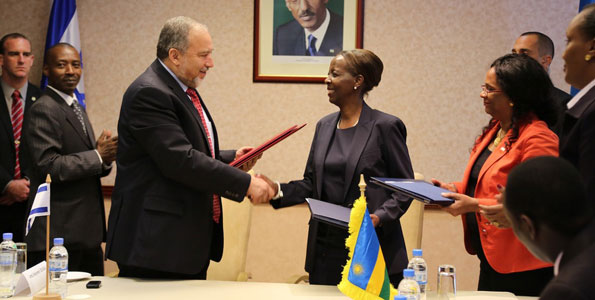 sraeli Minister for Foreign Affairs Avigdor Liberman and his Rwanda counterpart Louise Mushikiwabo exchange MoU documents on a Business and Investment pact between their countries in Kigali. Photo/Daniel Sabiiti