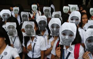 Students from an all-girls Catholic school, St Scholastica's College, wear masks depicting kidnapped African school girls in Manila, June 27, 2014. More than 1,000 girls took part in the protest outside their campus aimed at voicing outrage over the kidnapping of more than 200 girls from a school in northeast Nigeria in April by Boko Haram militants, a school official said.  Image by: ERIK DE CASTRO / REUTERS