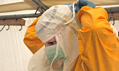 Dr Gabriel Fitzpatrick prepares for work with Ebola patients in Kailahun, in eastern Sierra Leone Photograph: MSF