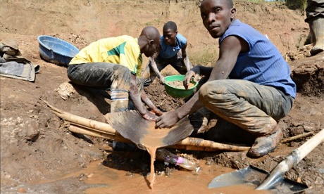 Men separate minerals near Congo’s Mudere mine. Artisanal miners are suffering as a result of attempts to ensure minerals are conflict free. Photograph: Junior D Kannah/AFP/Getty Images
