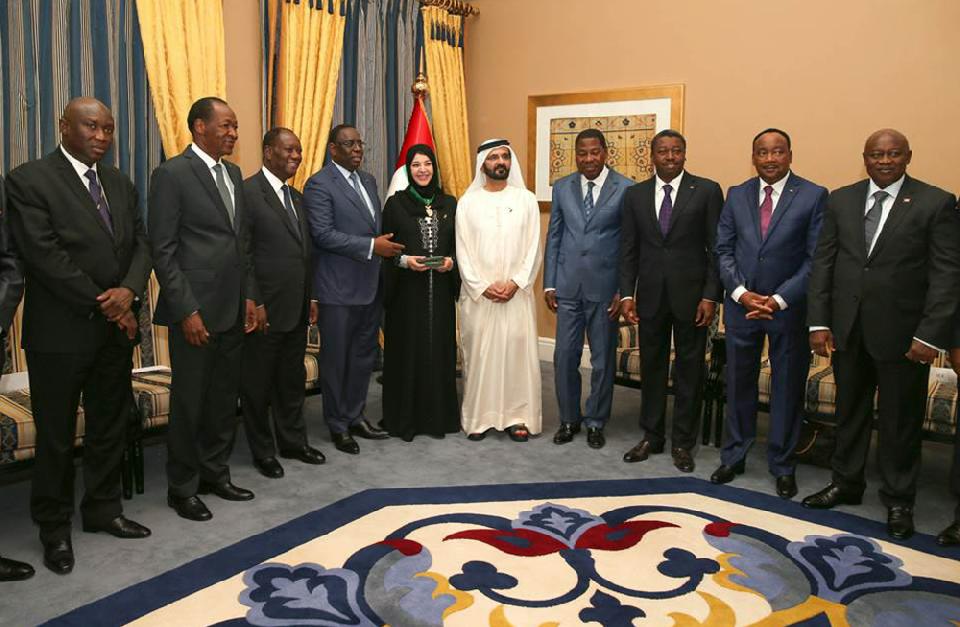 This handout photo made available by Dubai Media Office shows the UAE Vice President, Prime Minister and Ruler of Dubai, Sheikh Mohammed bin Rashid Al Maktoum, center, and Reem Ebrahim Al Hashimi, Minister of State, on his left, as they receive the Presidents and the presidential delegations from the eight UEMOA nations: Benin, Burkina-Faso, Cote d’Ivoire, Guinea- Bissau, Mali, Niger, Senegal, and Togo at the West African Investment Forum in Dubai, United Arab Emirates, Tuesday, Sept. 9, 2014. (AP Photo/Dubai Media Office)