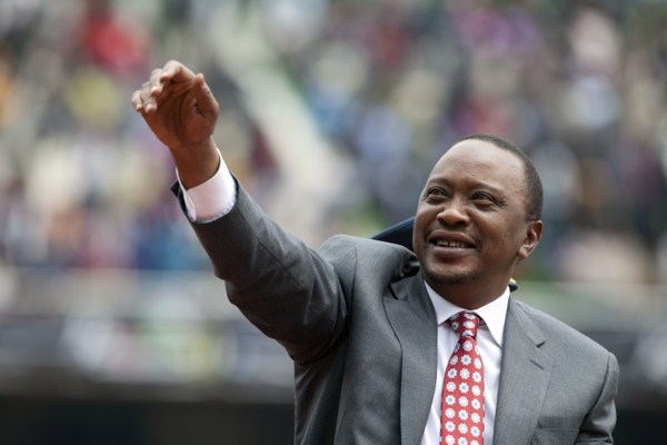 Kenyan president Uhuru Kenyatta waves to the crowd as Kenya celebrates 50 years of independence in Nairobi, Kenya, Dec. 12, 2013 (AP photo by Sayyid Azim).