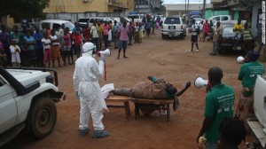 Aid workers from the Liberian Medical Renaissance League stage an Ebola awareness event October 15 in Monrovia, Liberia. The group performs street dramas throughout Monrovia to educate the public on Ebola symptoms and how to handle people who are infected with the virus.
