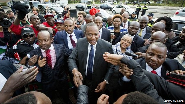 On Wednesday, Uhuru Kenyatta (C) shook hands with supporters outside The Hague court